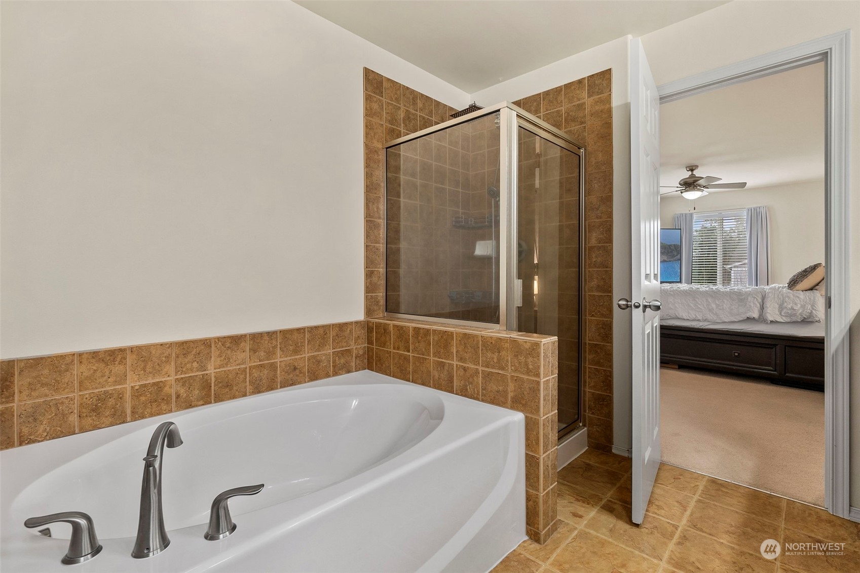 1328 Foreman Road DuPont, WA 98327 - Photo 30 of 37 a bathroom with a tub and sink