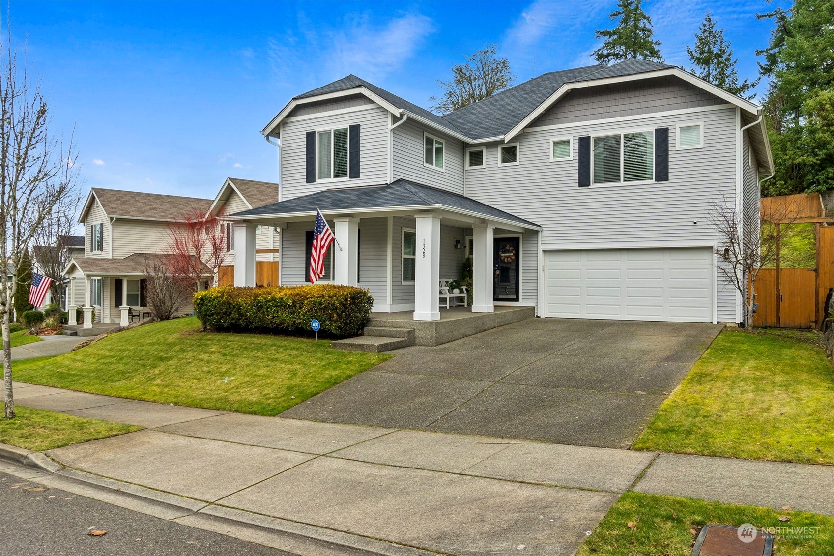 1328 Foreman Road DuPont, WA 98327 - Photo 3 of 37 a front view of a house with garden
