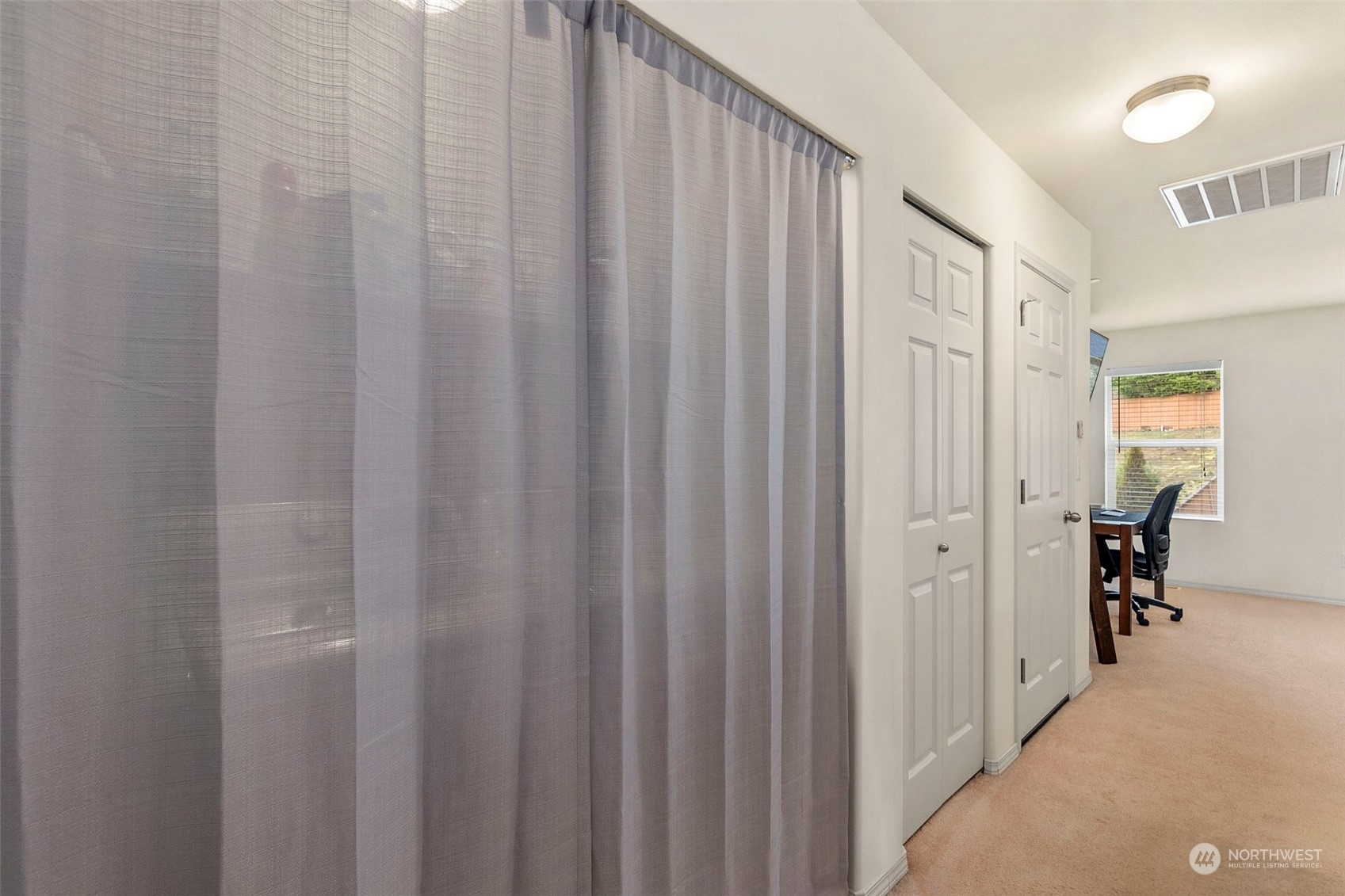 1328 Foreman Road DuPont, WA 98327 - Photo 32 of 37 a view of a hallway with wooden floor