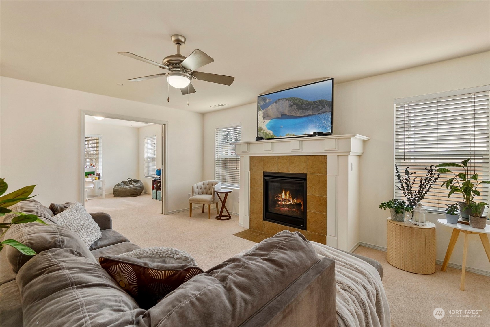 1328 Foreman Road DuPont, WA 98327 - Photo 8 of 37 a living room with furniture and a fireplace