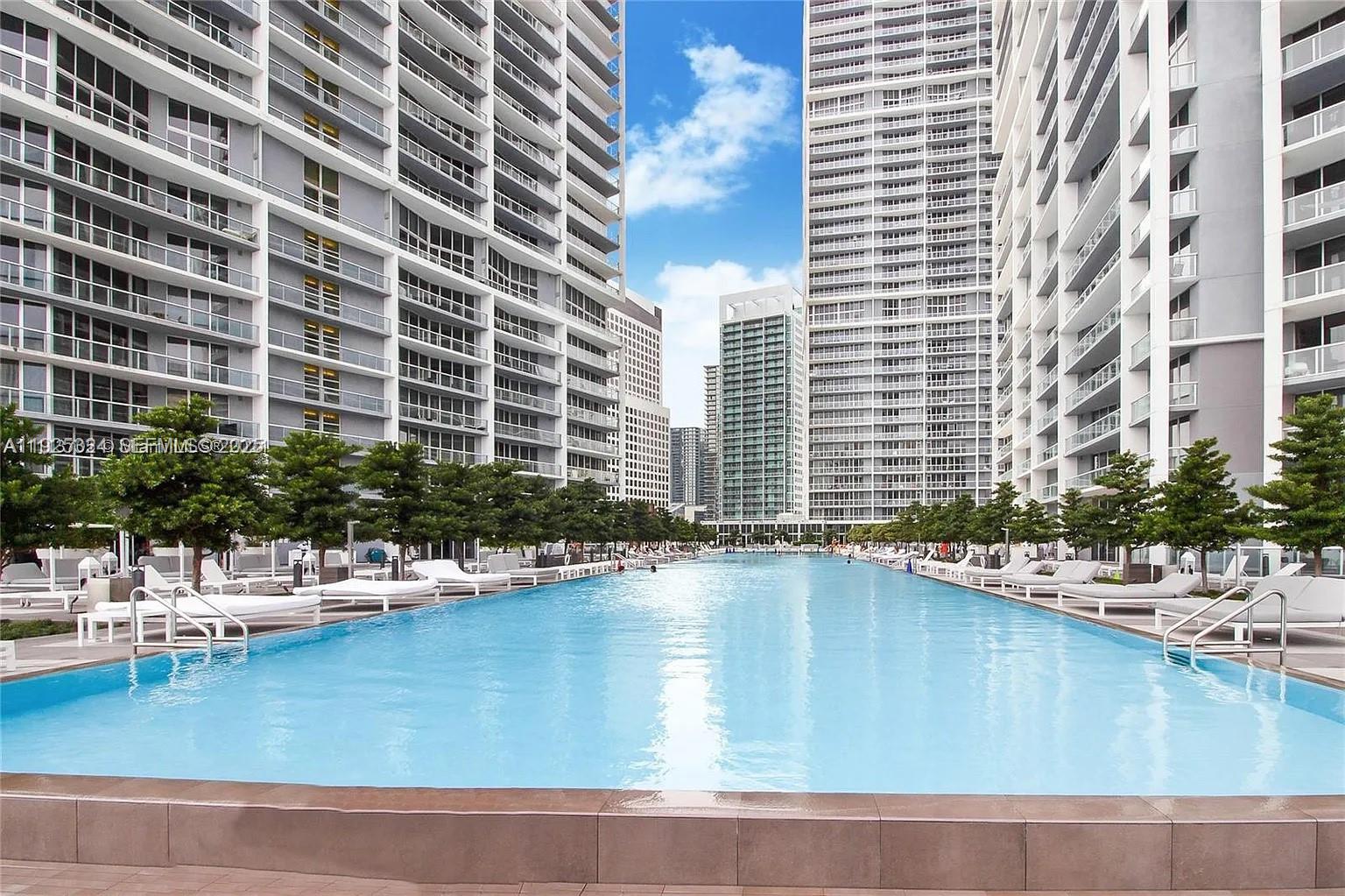 495 Brickell Avenue, Unit 3304 Miami, FL 33131 - Photo 20 of 28 a view of a swimming pool with outdoor seating