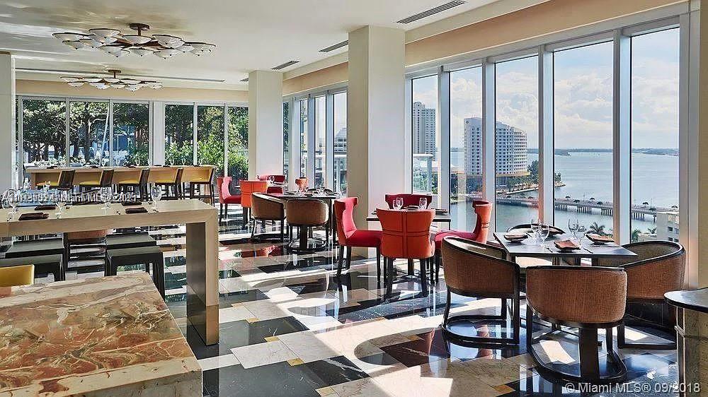 495 Brickell Avenue, Unit 3304 Miami, FL 33131 - Photo 24 of 28 a outdoor space with lots of furniture and glass windows