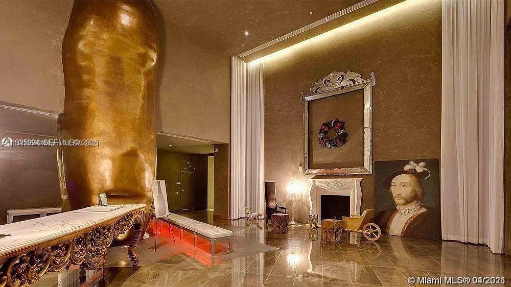 495 Brickell Avenue, Unit 3304 Miami, FL 33131 - Photo 27 of 28 a bedroom with bed and a fireplace