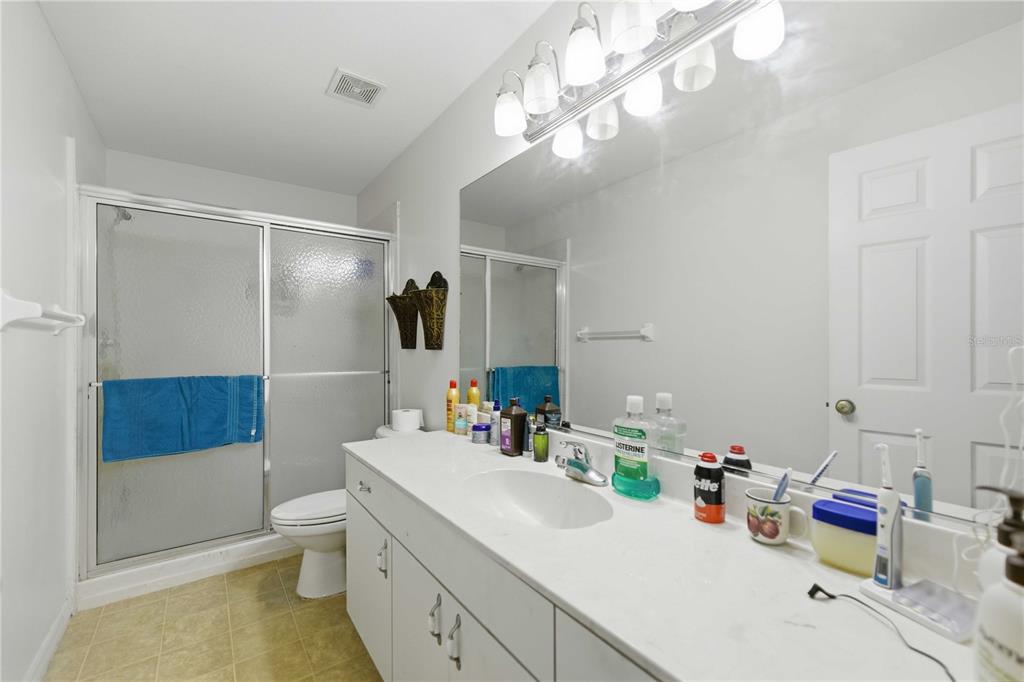 3959 Southwest 129th Street Ocala, FL 34473 - Photo 16 of 27 a bathroom with a sink a toilet and shower