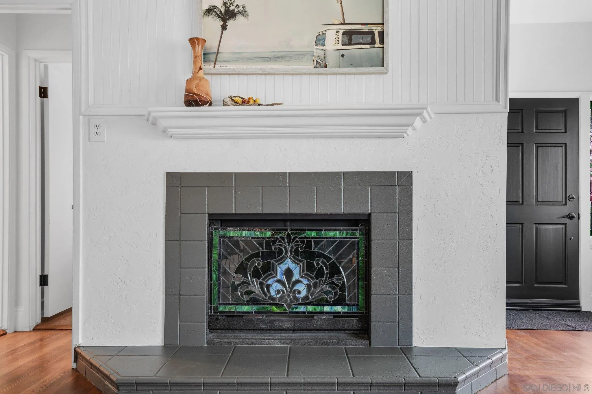 4635 4th Street La Mesa, CA 91941 - Photo 12 of 53 a living room with a fireplace and a fireplace