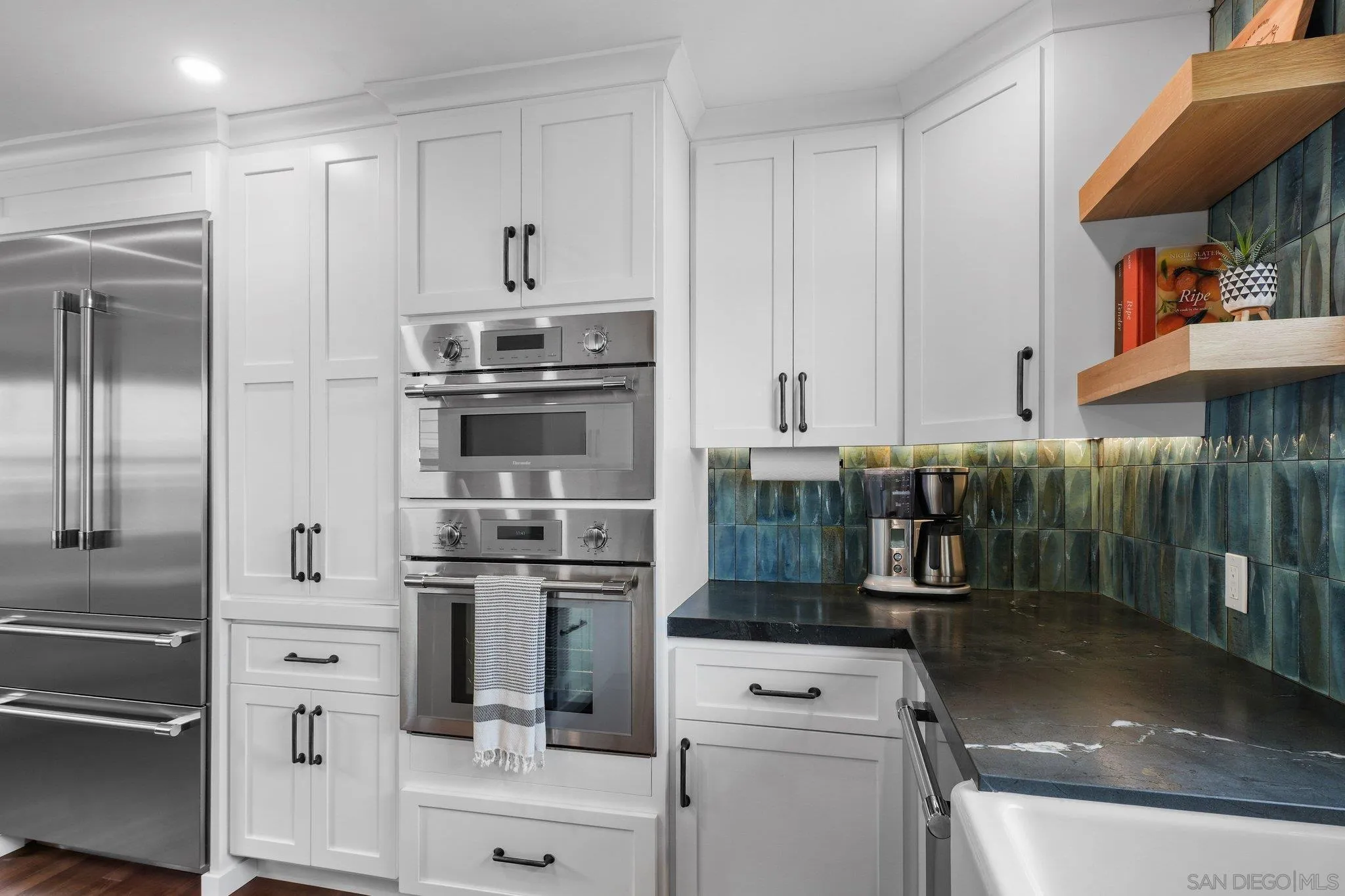 4635 4th Street La Mesa, CA 91941 - Photo 15 of 53 a kitchen with appliances a sink and cabinets