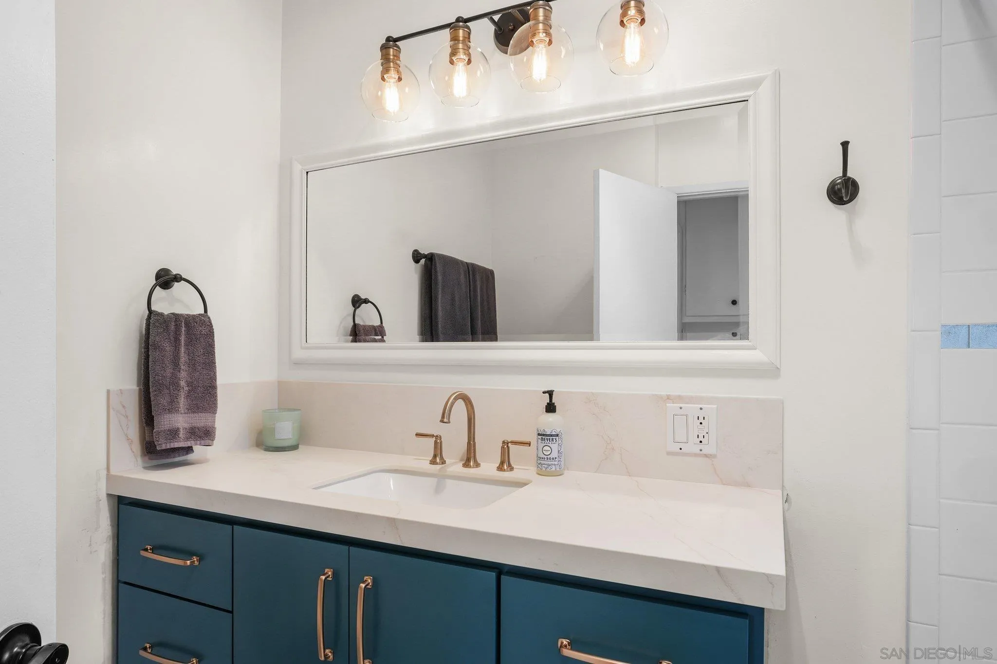 4635 4th Street La Mesa, CA 91941 - Photo 21 of 53 a bathroom with a sink and a mirror