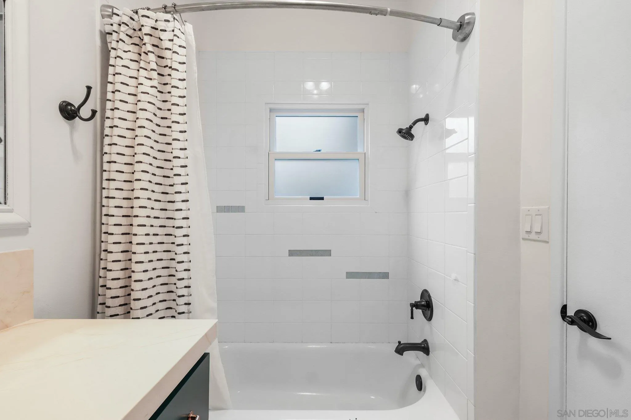 4635 4th Street La Mesa, CA 91941 - Photo 22 of 53 a bathroom with a bathtub and shower