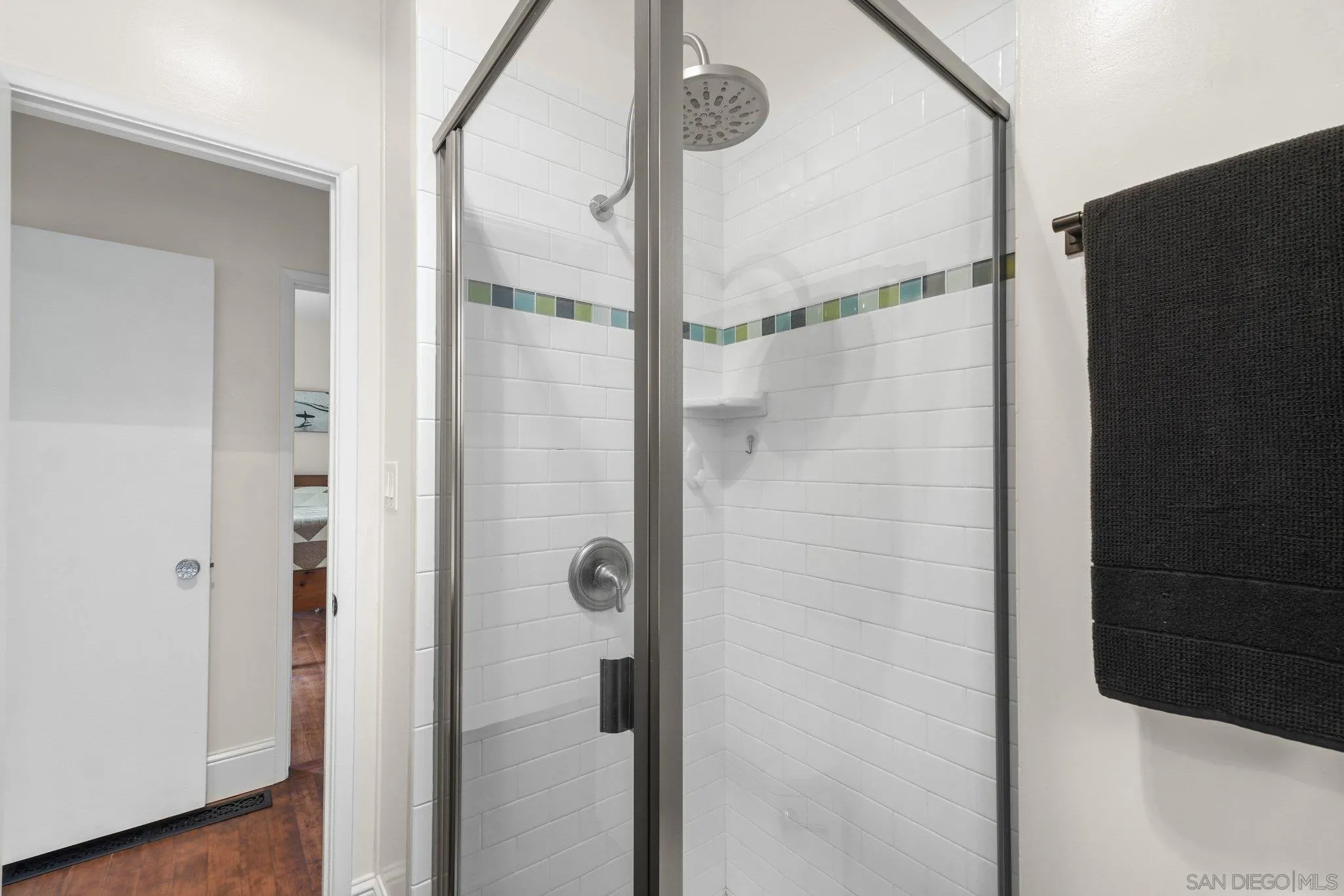 4635 4th Street La Mesa, CA 91941 - Photo 28 of 53 a bathroom with a glass shower door
