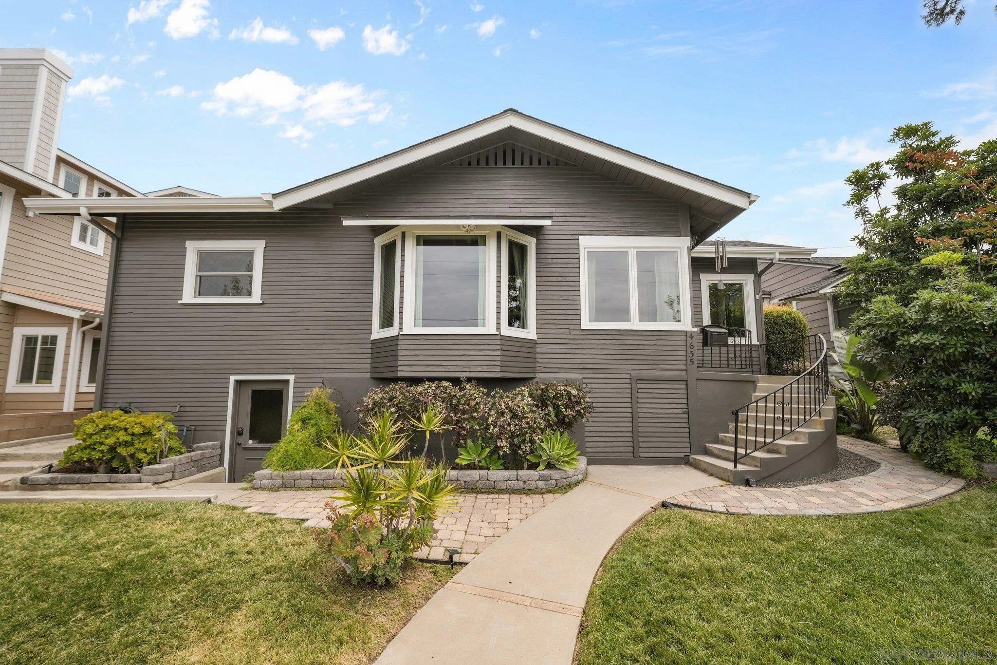 4635 4th Street La Mesa, CA 91941 - Photo 4 of 53 a front view of a house with a yard