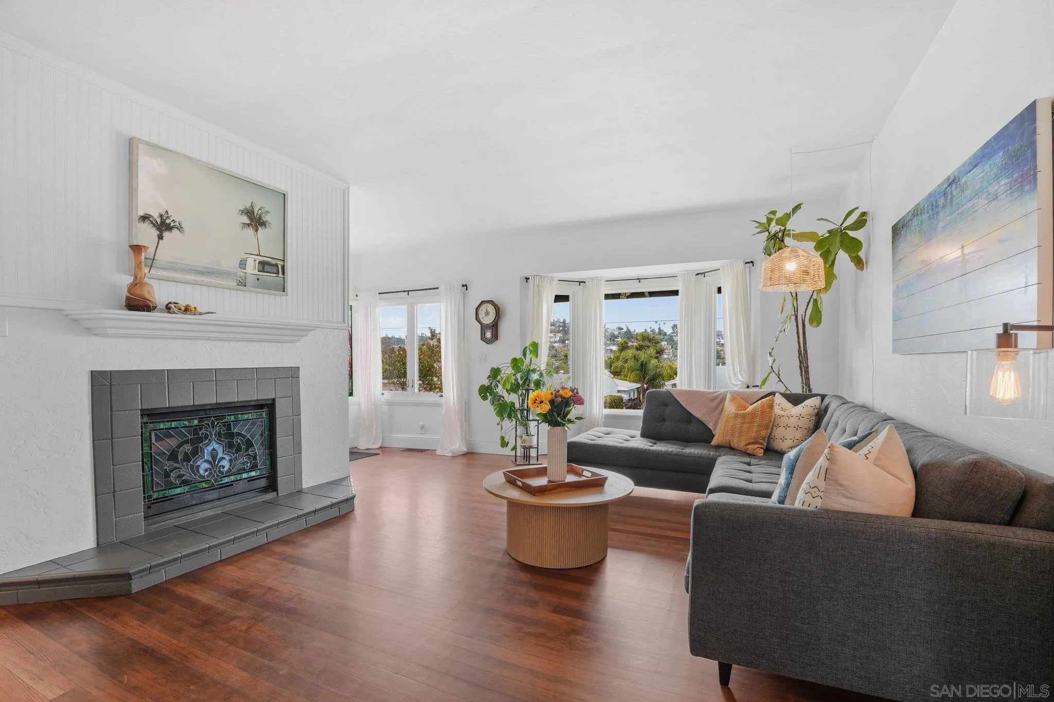 4635 4th Street La Mesa, CA 91941 - Photo 10 of 53 a living room with fireplace furniture and wooden floor