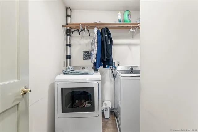 a bathroom with a sink and a painting on the wall