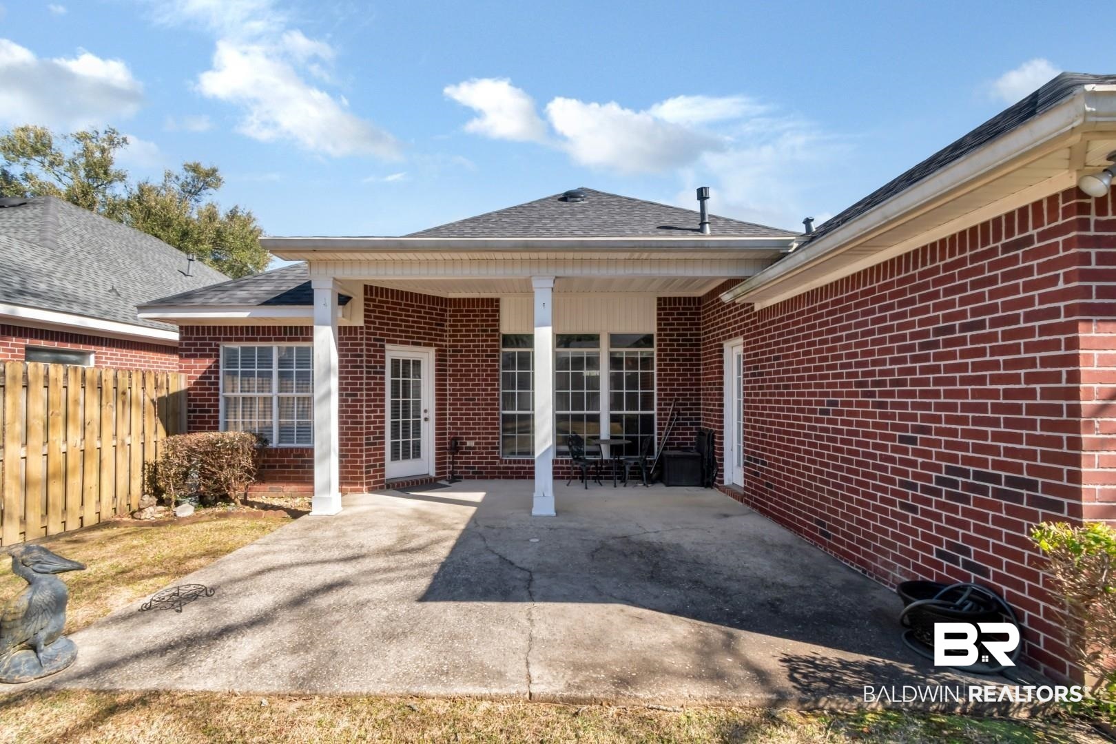 1032 Cross Gates Place Mobile, AL 36609 - Photo 31 of 34 Back of house with a patio area, a shingled roof, and brick siding