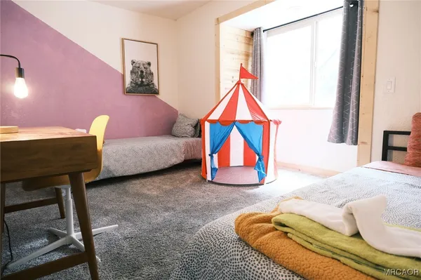 a bedroom with furniture and a bed