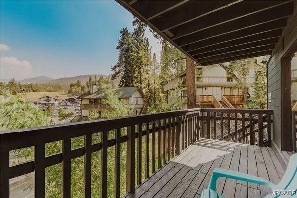 a view of balcony with furniture