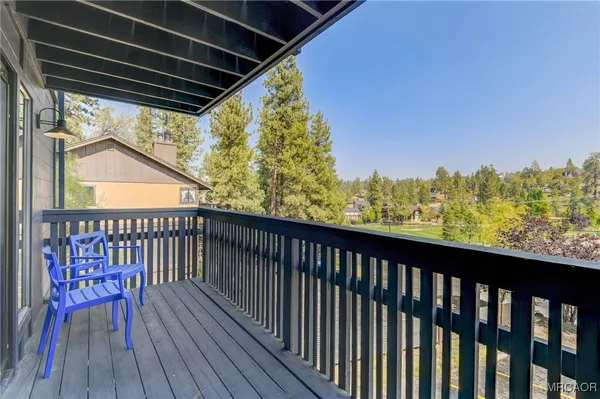 a view of balcony with wooden floor