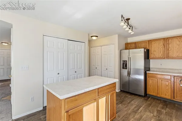 a kitchen with stainless steel appliances a refrigerator and a sink