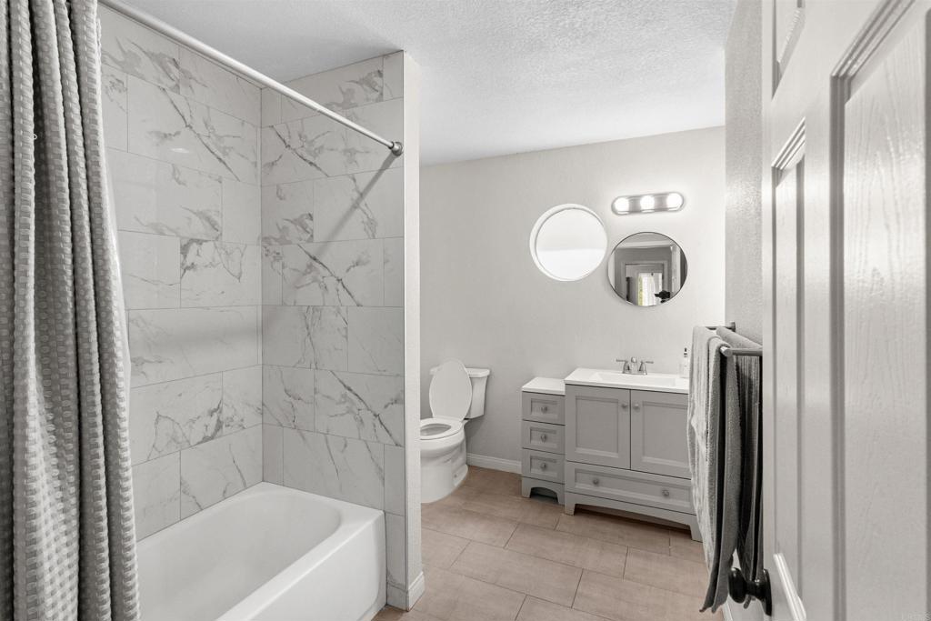 3340 Skytrail Ranch Road Jamul, CA 91935 - Photo 21 of 38 a bathroom with a tub sink and mirror