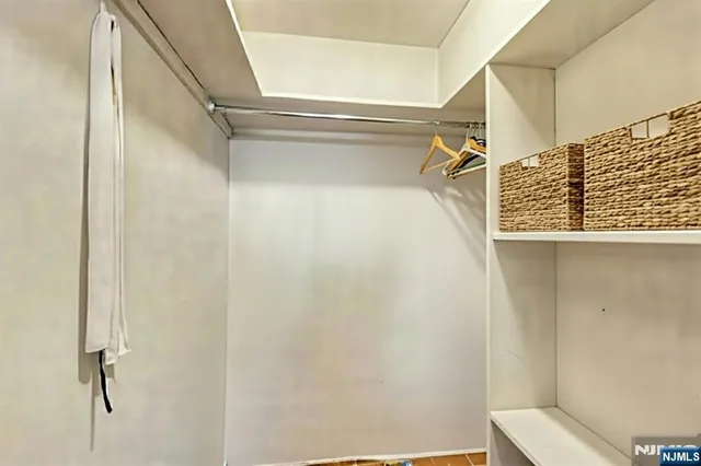 a view of a white house with a yard