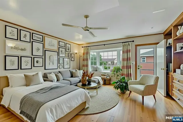 a bedroom with a bed a table and chair