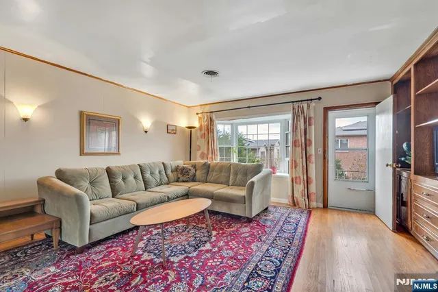 a living room with furniture and a rug