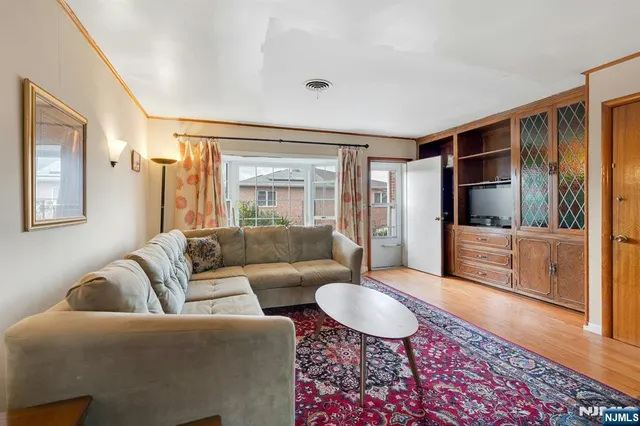 a living room with furniture and a rug