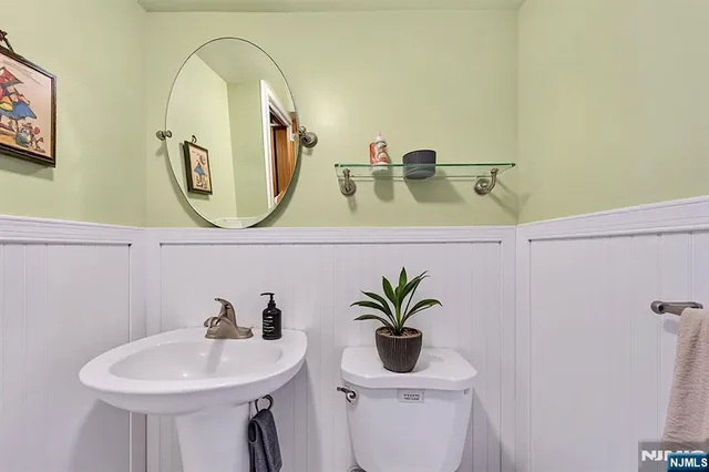 a bathroom with a sink a mirror and vanity