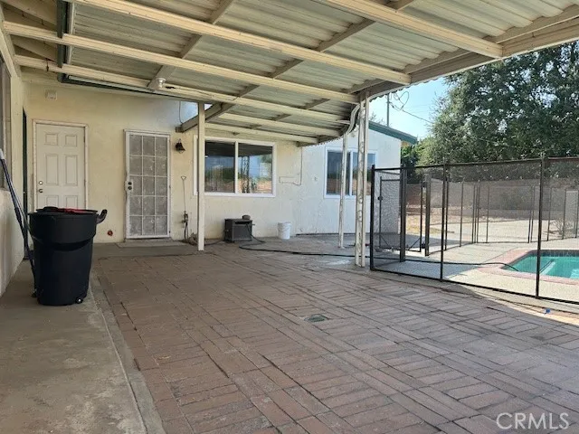 a view of a livingroom with wooden floor and a fireplace