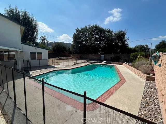 a view of a house with a swimming pool