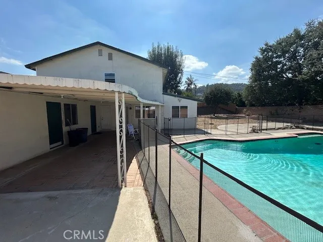 a view of a house with a swimming pool