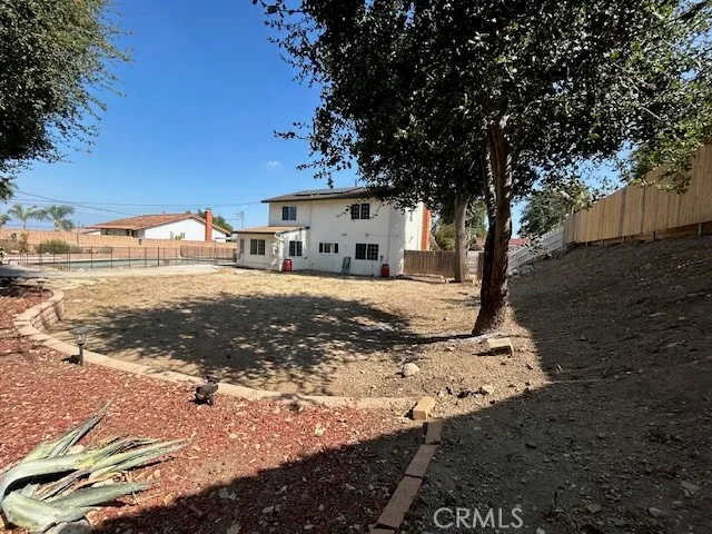 a view of a backyard with sitting area