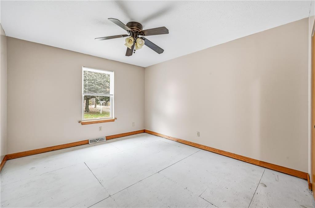 3451 East State Road Jamestown, PA 16134 - Photo 21 of 49 an empty room with windows and fan