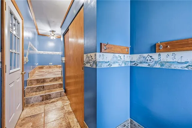 a view of a room with wooden floor