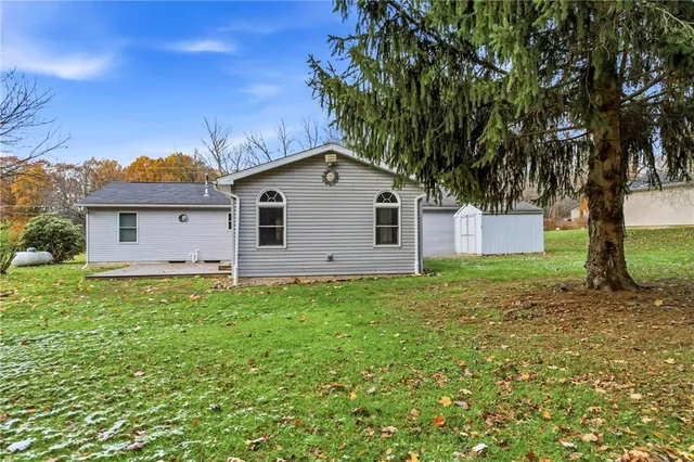 a view of a wooden deck front of house