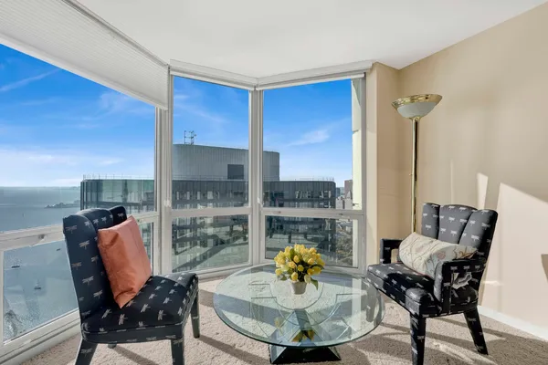 a living room with furniture and a table