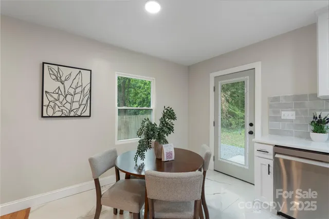 a dining room with furniture and window