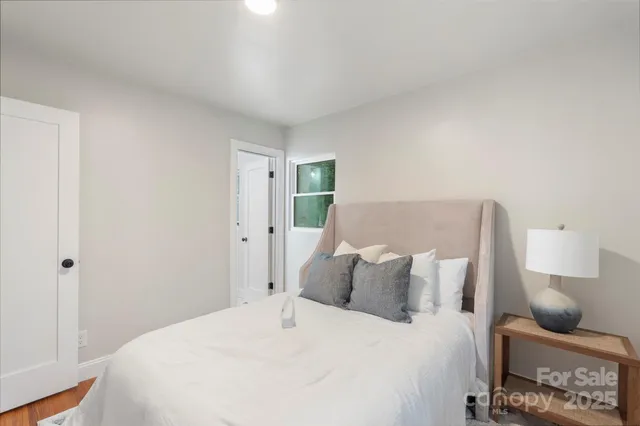 a bedroom with a bed and furniture