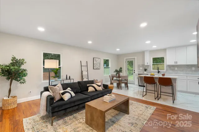 a living room with furniture and a large window