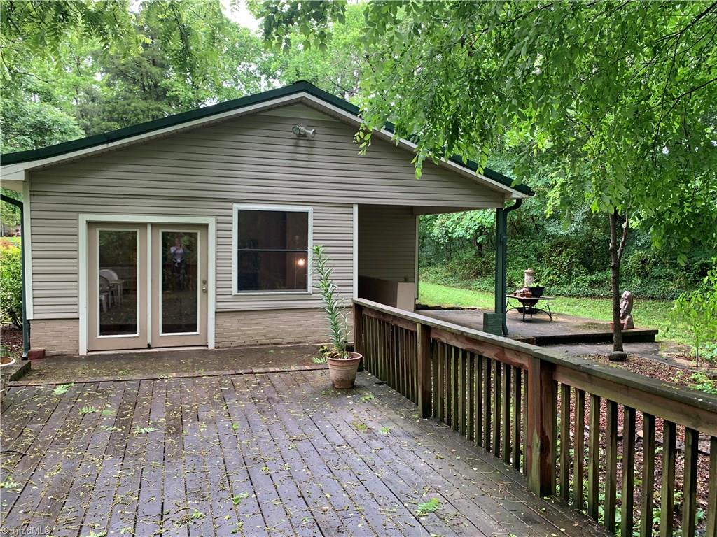 4680 Seward Road Pfafftown, NC 27040 - Photo 2 of 22 STANDING ON OVER SIZED DECK LOOKING INTO BACK YARD AND PATIO