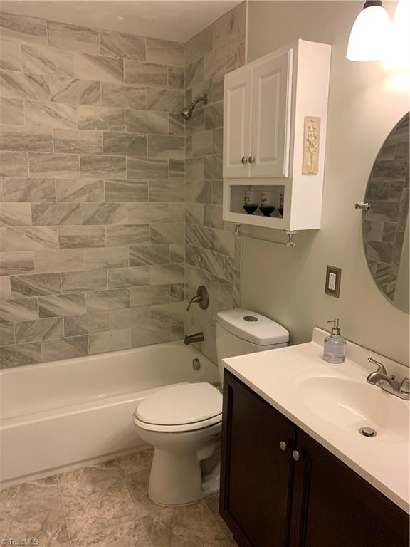 4680 Seward Road Pfafftown, NC 27040 - Photo 14 of 22 NEWLY REMODELED BATHROOM, TILE FLOOR AND SURROUND