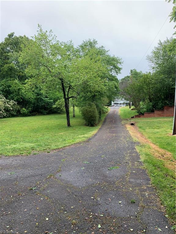 4680 Seward Road Pfafftown, NC 27040 - Photo 21 of 22 FRONT YARD, PAVED DRIVE, STANDING AT HOUSE LOOKING TOWARDS ROAD