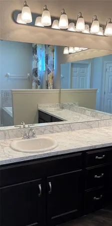 a view of a kitchen counter space and wooden floor