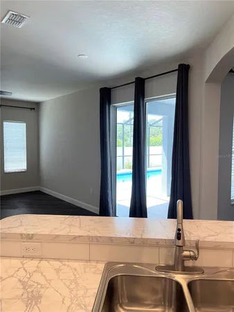 a bathroom with a sink and a large mirror