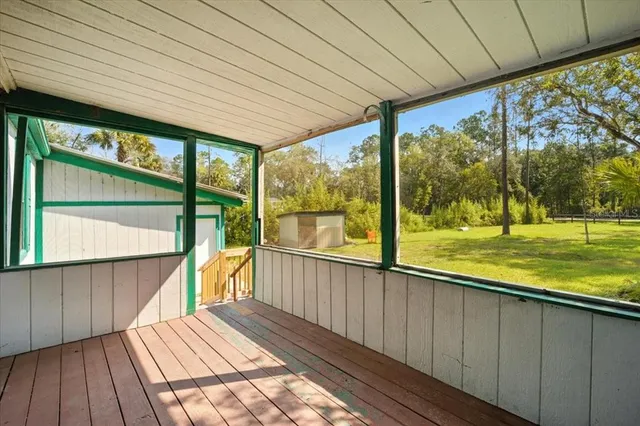 a view of outdoor space with wooden floor and outdoor space