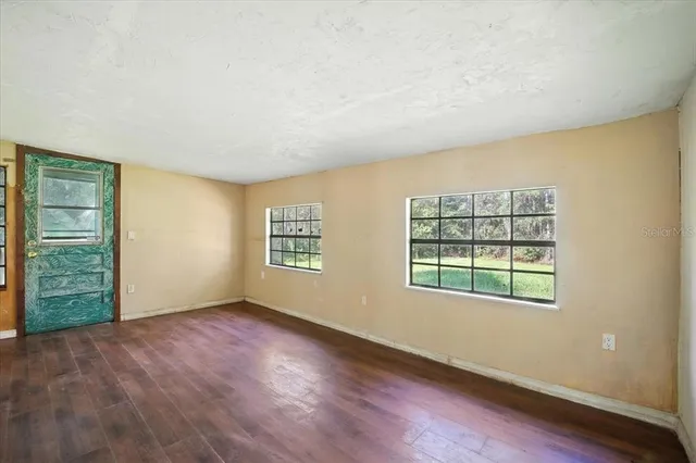 an empty room with windows