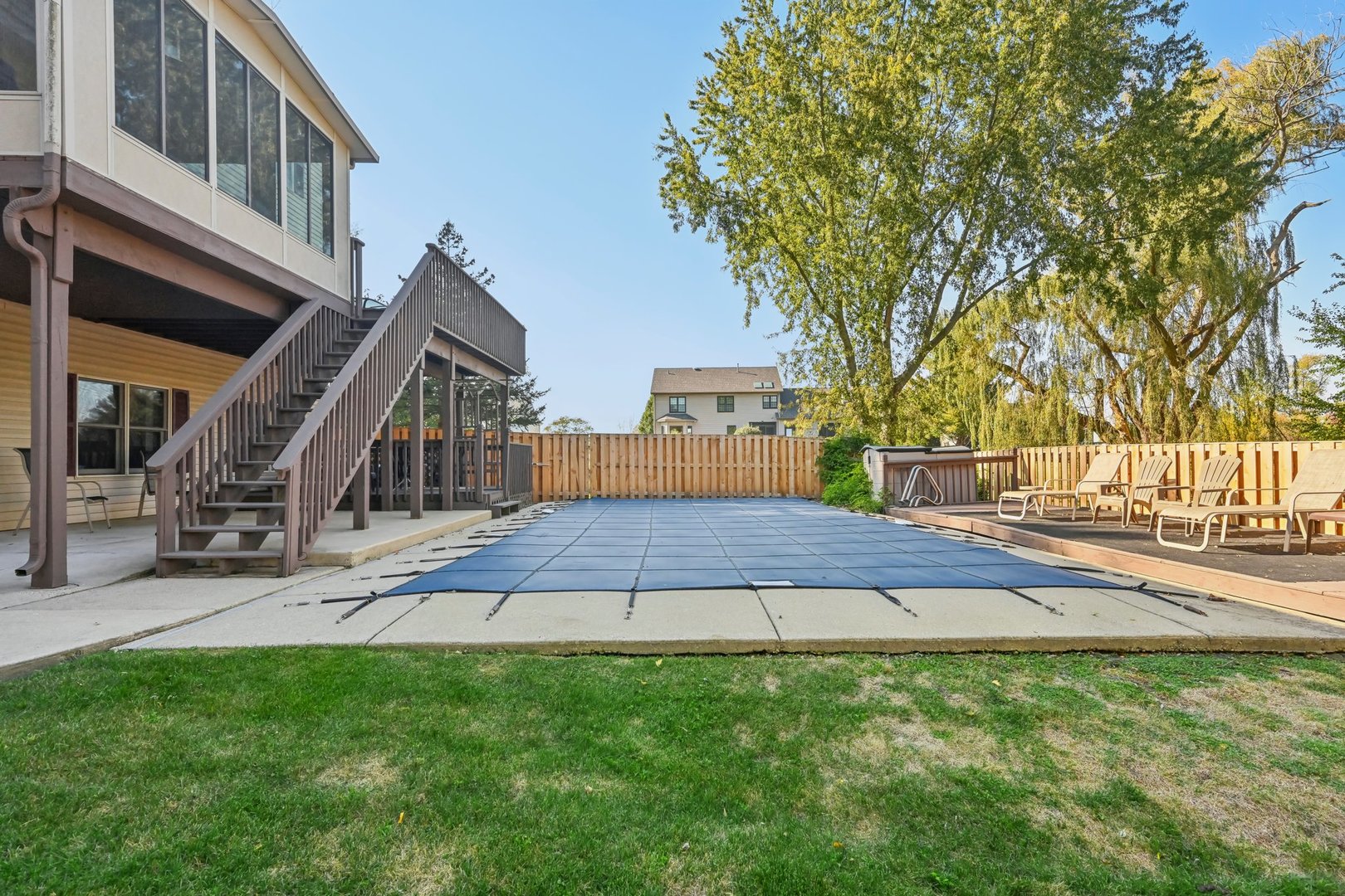 14N599 Timber Ridge Drive Elgin, IL 60124 - Photo 47 of 51 a view of a backyard with plants and wooden fence