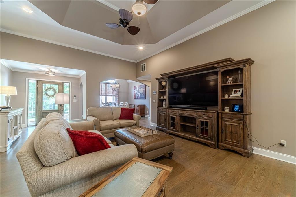 4415 Locklin Road Monroe, GA 30655 - Photo 20 of 79 a living room with furniture and a flat screen tv