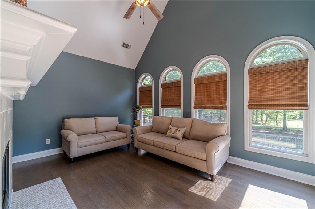 4415 Locklin Road Monroe, GA 30655 - Photo 22 of 79 a living room with furniture and a large window