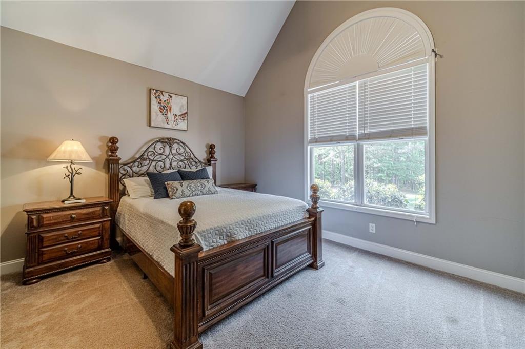 4415 Locklin Road Monroe, GA 30655 - Photo 32 of 79 a bedroom with a bed and a window
