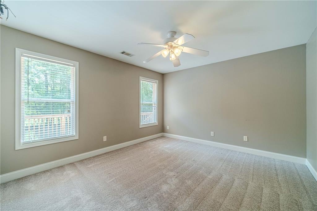 4415 Locklin Road Monroe, GA 30655 - Photo 35 of 79 an empty room with windows and fan